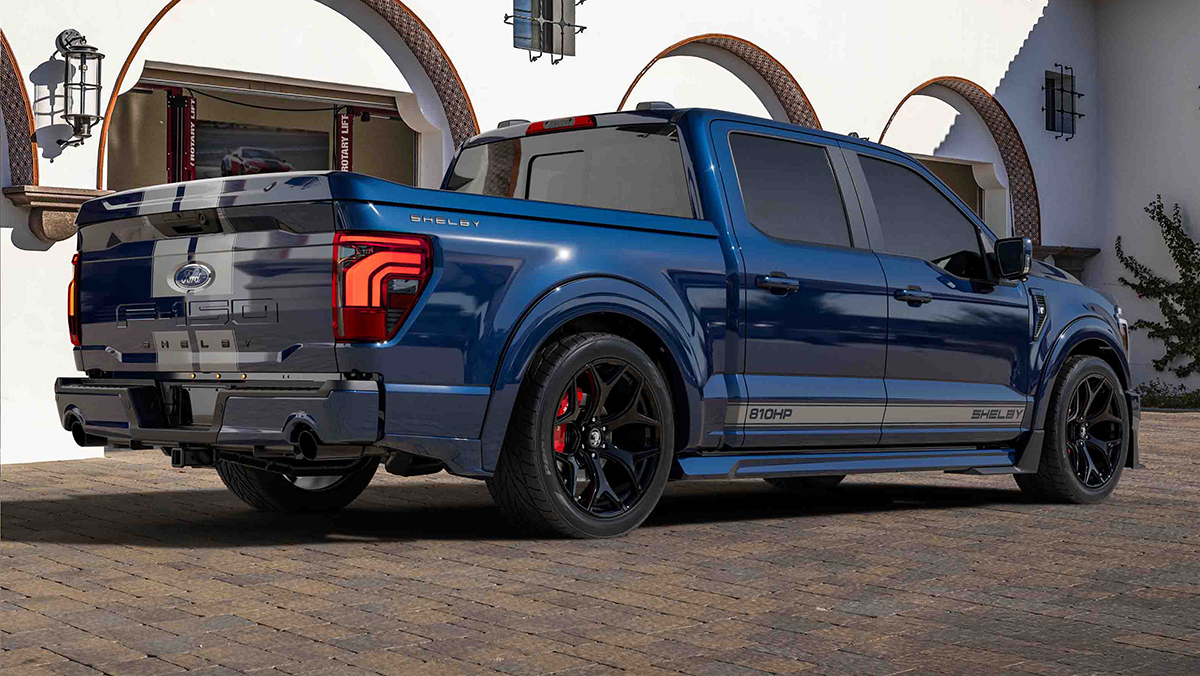 Blue Shelby F-150 Super Snake SuperCrew three-quarter rear view parked in front of building