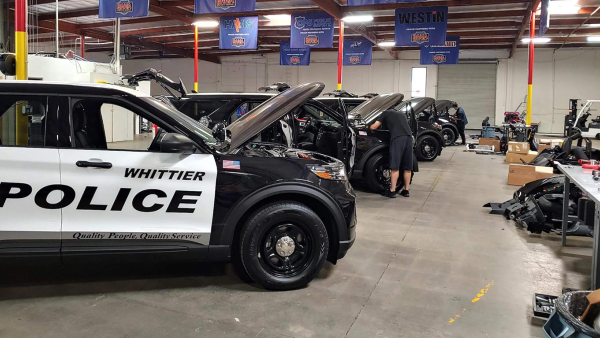 Dana Safety Supply shop with Police SUVs