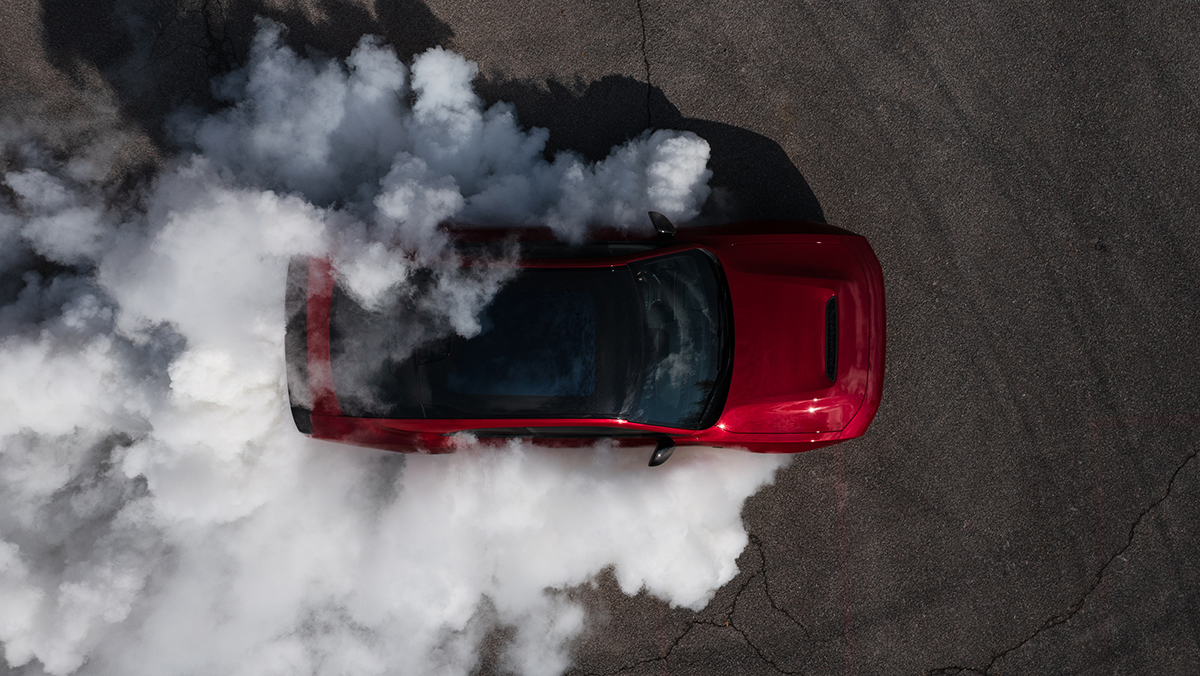 SIXPACK-powered 2027 Dodge Charger Scat Pack aerial shot smoking tires