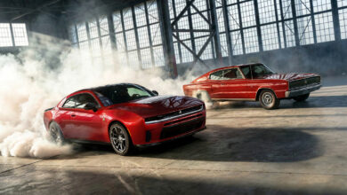 Modern and Classic Dodge Charger burning tires in warehous