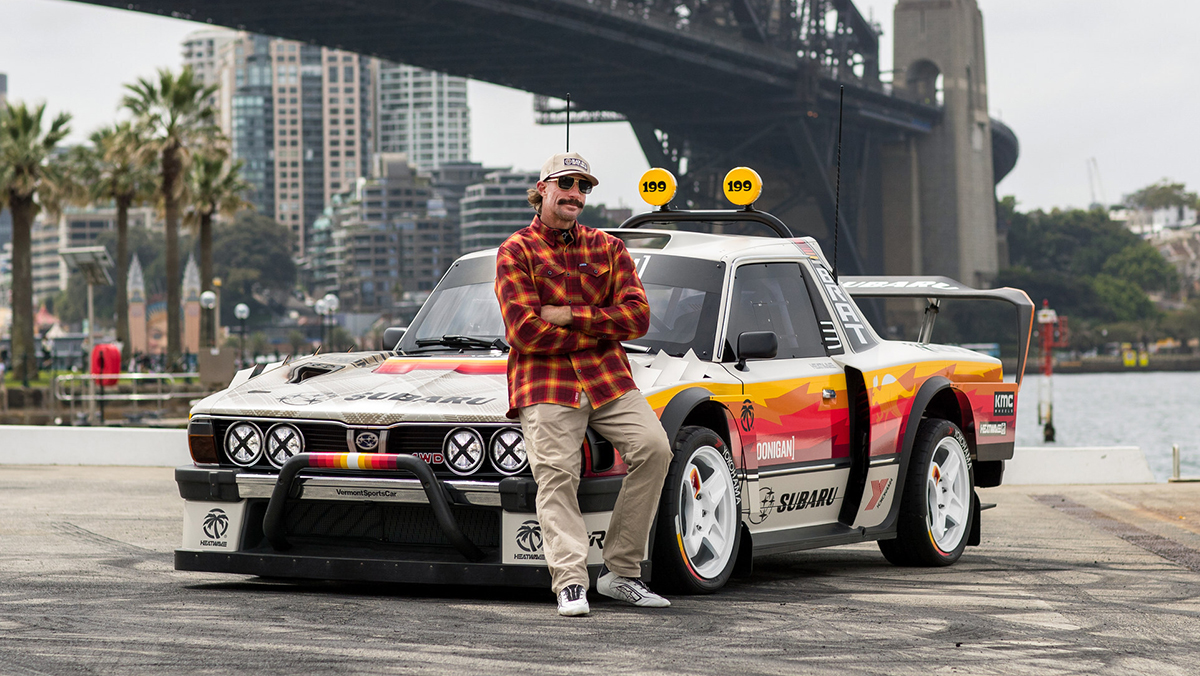 Travis Pastrana leaning against the Subaru Brataroo 9500 Turbo