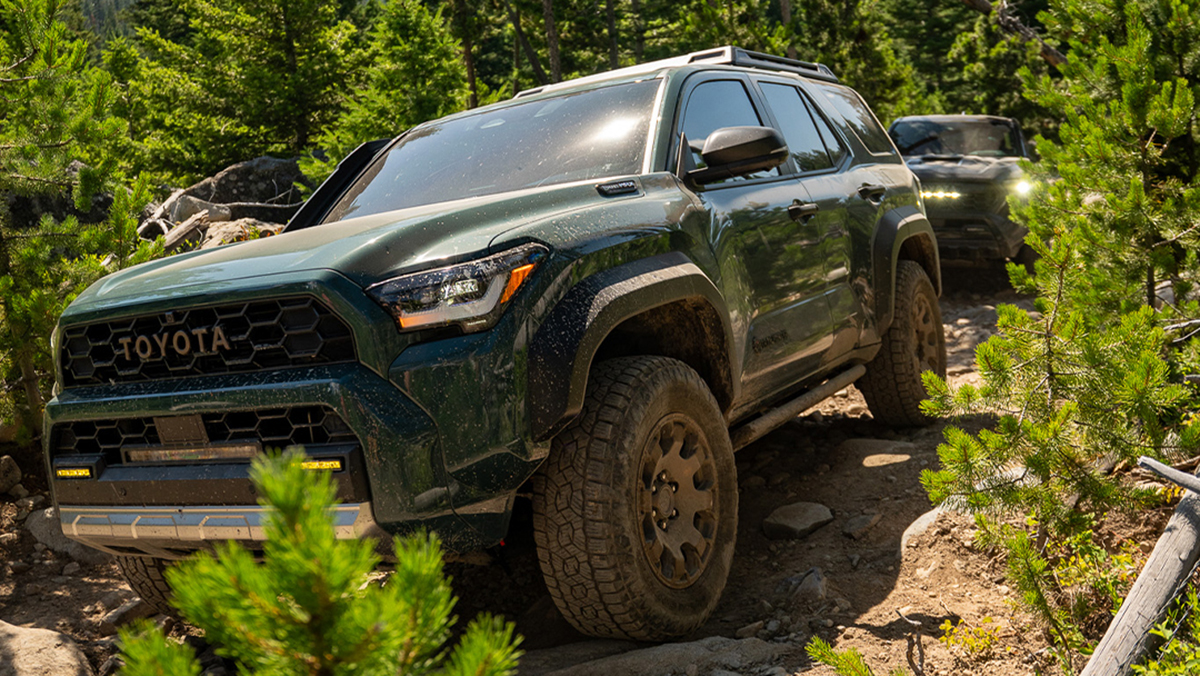 Toyota vehicle driving on forest trail