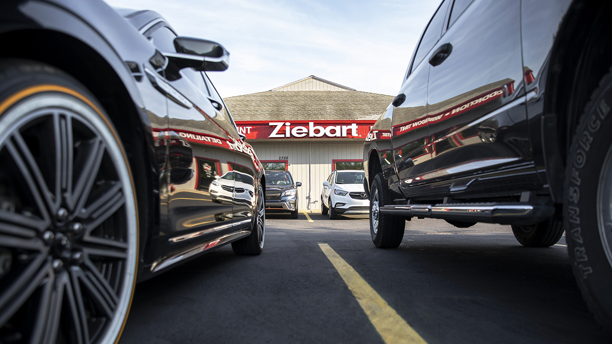 Shot of Ziebart shop from between two cars