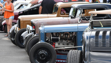 Hood of classic cars parked in a row