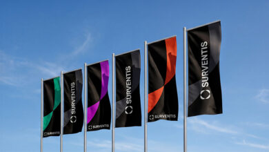Row of Surventis branded flags
