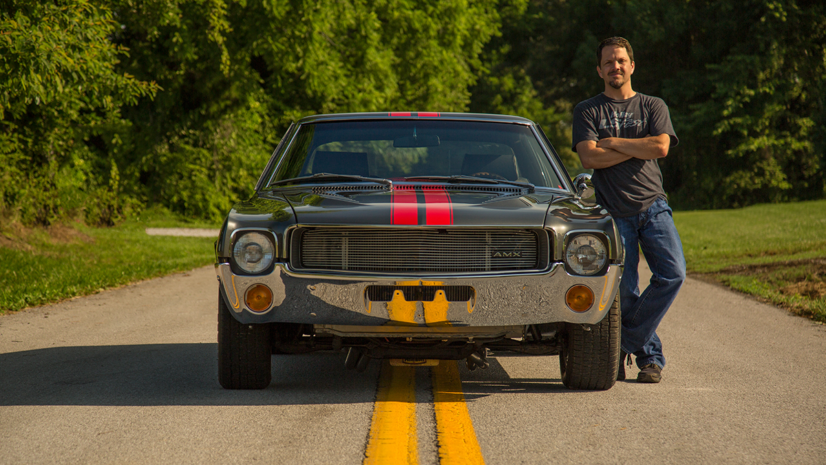 Bill Tichenor standing next to car
