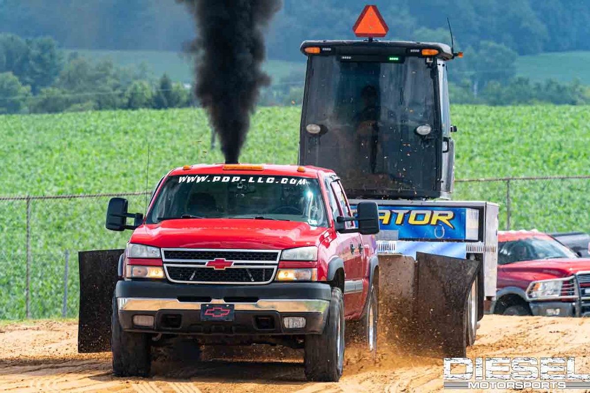 diesel motorsports red chevy diesel truck competes in sled pull