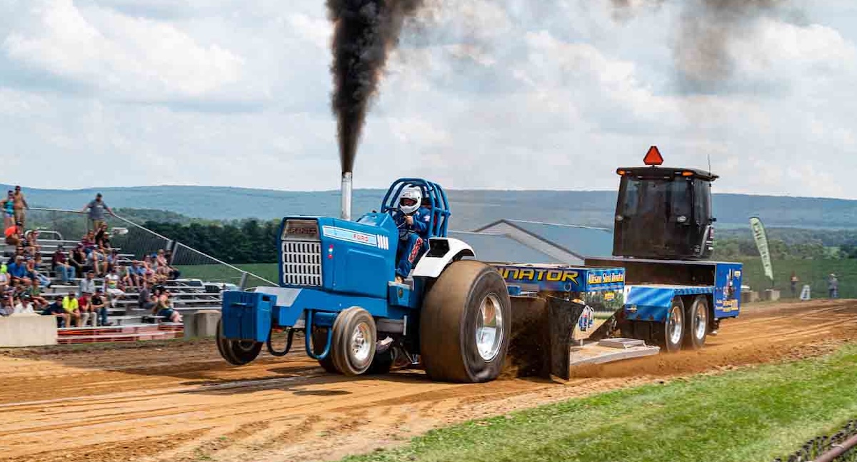 diesel motorsports blue tractor competes in sled pulling event