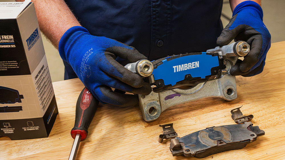 Person working with Timbren Brake Enhancement System (BES) is here on workbench