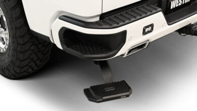 The all-new Westin Manual Retractable Bed Step extened below rear bumper of truck