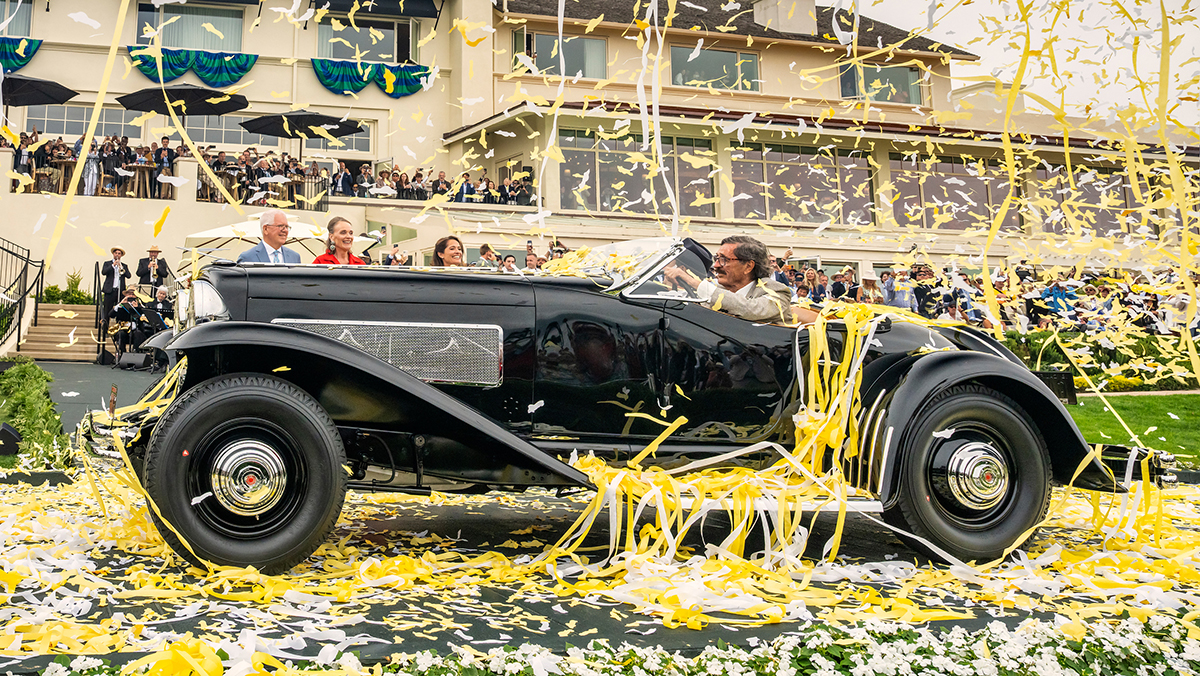 A 1935 Duesenberg SSJ with falling confetti