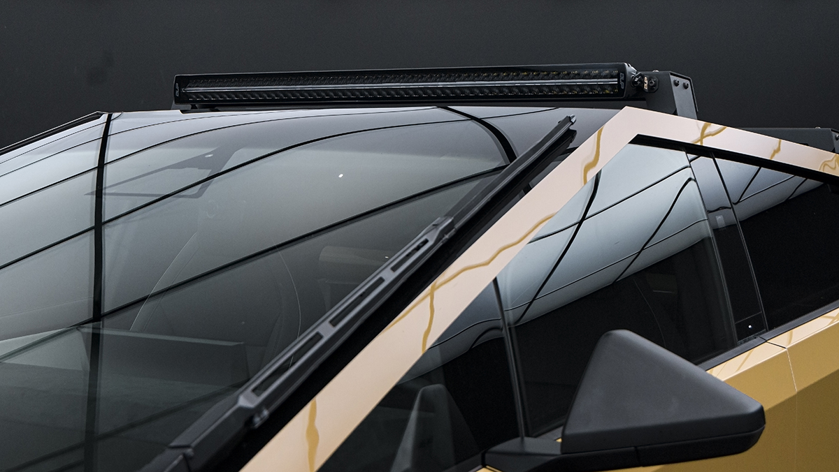 Closeup of light bar on roof rack on Unplugged Performance Invincible Tesla Cybertruck