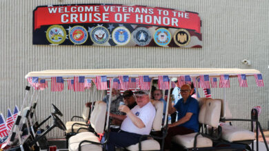 Vetrans in golf cart at Cuise of Honor during Iola Car Show