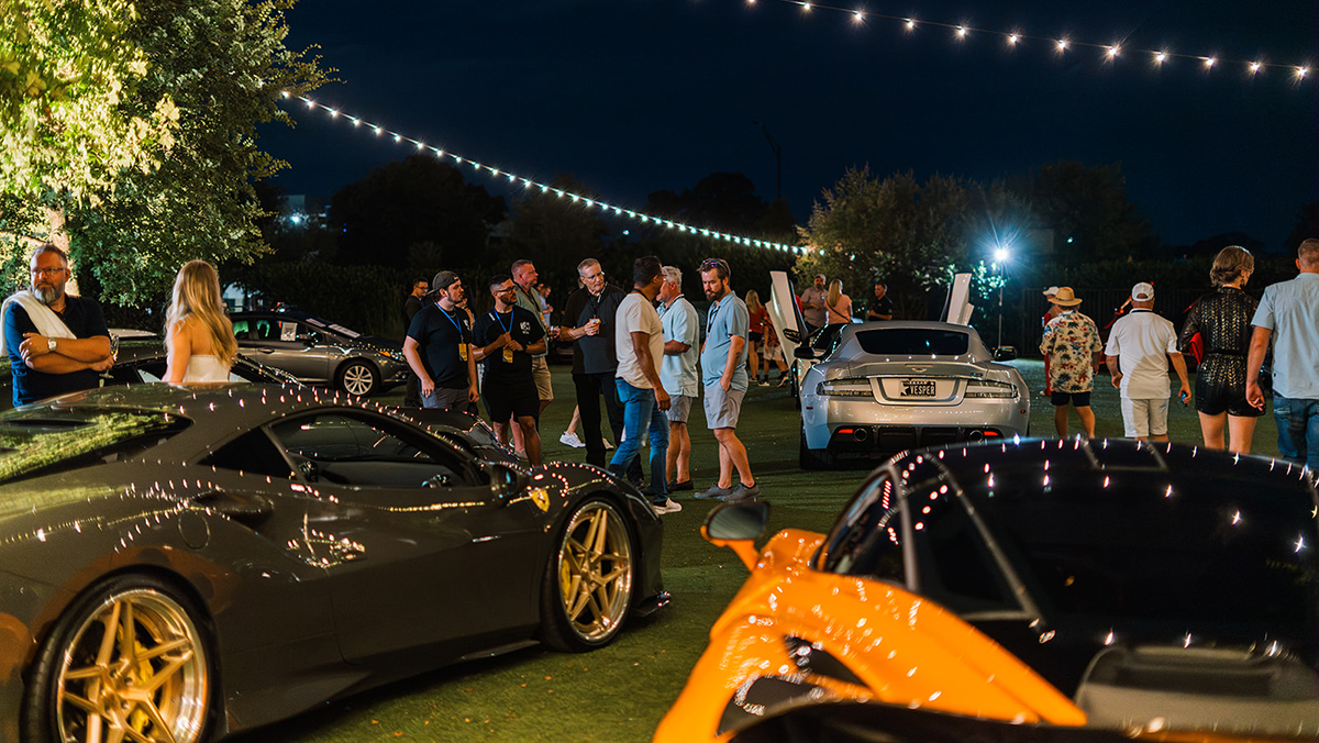 2024 Wheels | Watches | Whiskey with cars and people at night