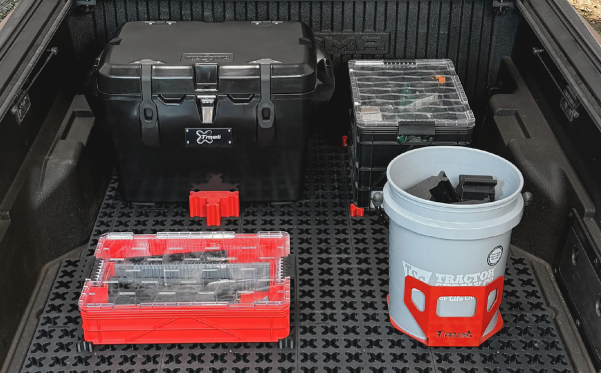 toolboxes cargo carriers tmat organized items in truck bed on mat