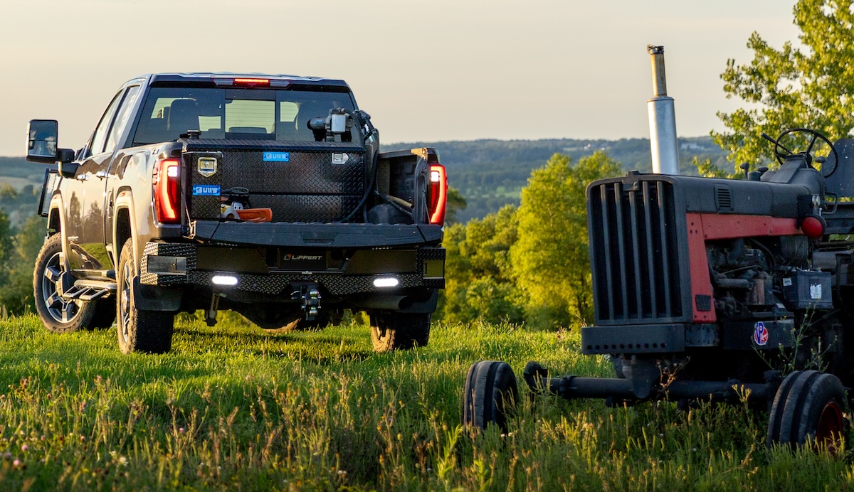 toolboxes cargo carriers truck bed toolbox rear of truck parked in farm field with tractor