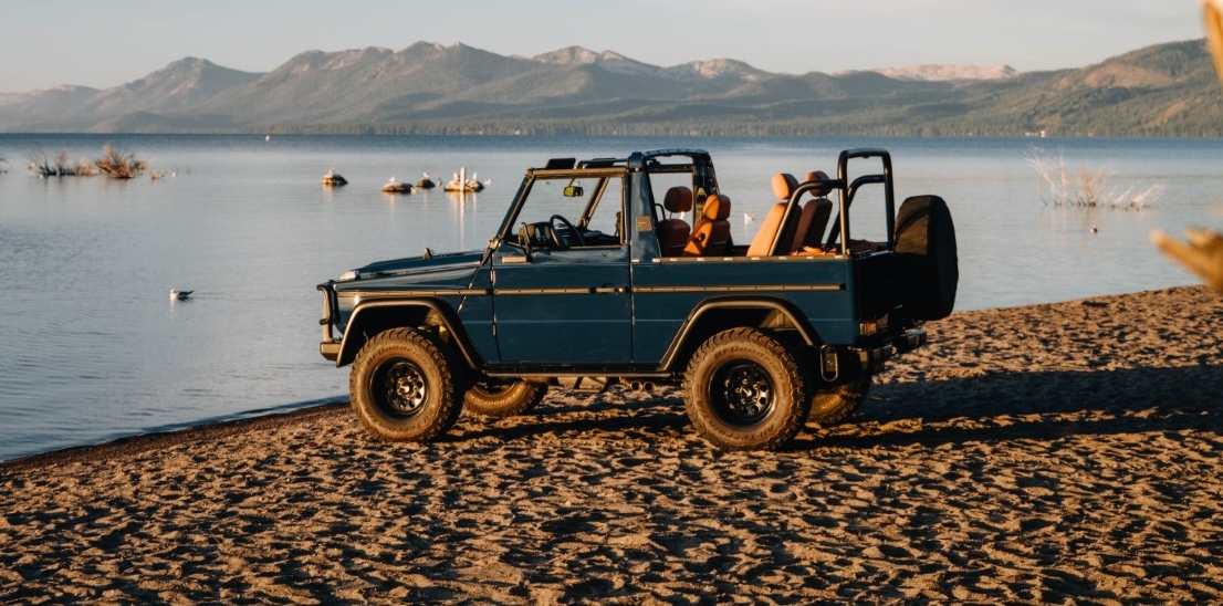 curated touring green G-class build on beach