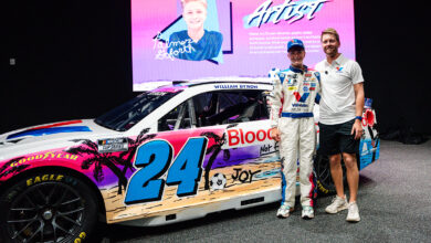 Palmer Goforth and William Byron stand next to No. 24 Valvoline Chevrolet.