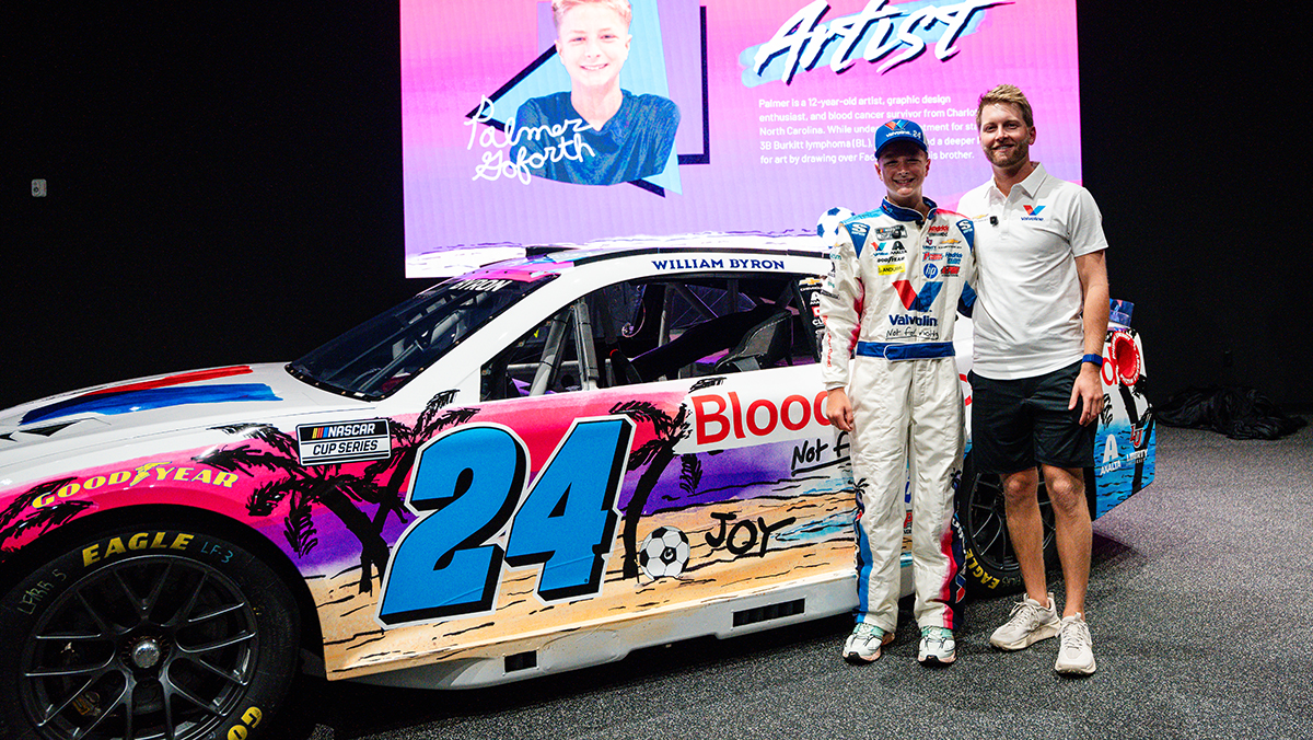 Palmer Goforth and William Byron stand next to No. 24 Valvoline Chevrolet.