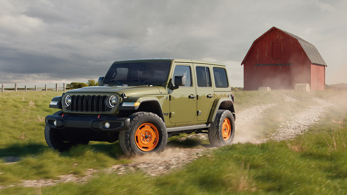 Green 2027 Jeep Wrangler JL-2A with barn in background