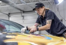 lettering express avery dennison trainer charlie trujillo lays a hood graphic