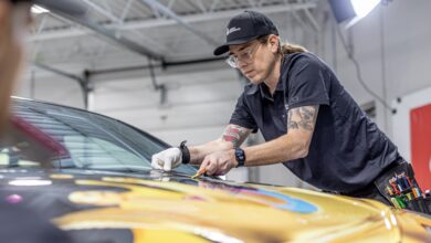 lettering express avery dennison trainer charlie trujillo lays a hood graphic