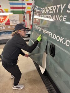 lettering express avery dennison trainer charlie trujillo lays a van-side graphic