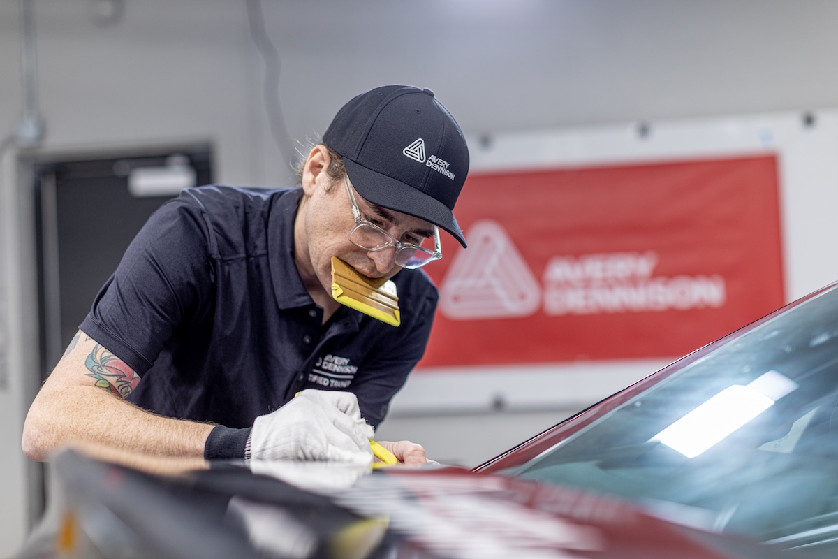 lettering express avery dennison trainer charlie trujillo hand cuts a wrap