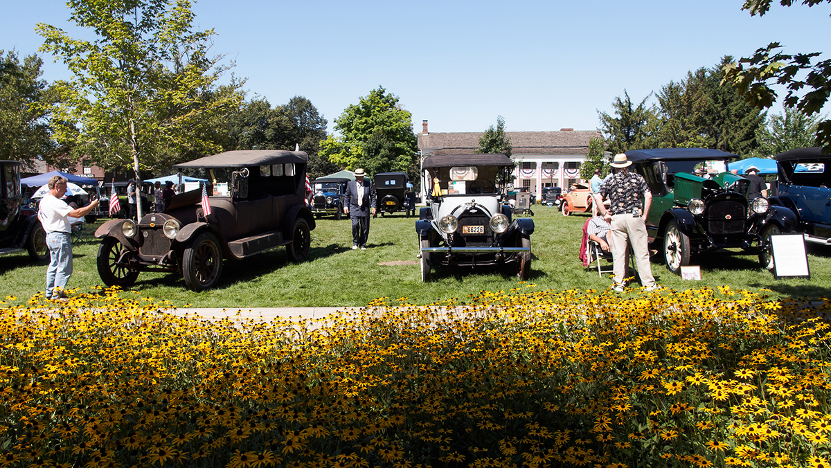 Old Car Festival with people and antique cars on lawn