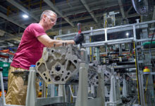 A worker at GM’s Flint Engine Operations, where the all-new Gen-6 5.7L and 6.6L V8s are assembled.
