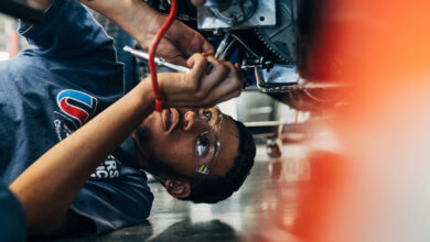 UTI student working on car