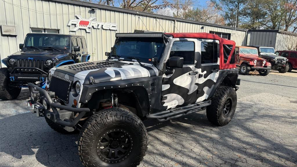 Custom Jeeps parked in front FORTEC4x4 building
