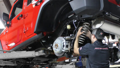Auto tech working under Jeep