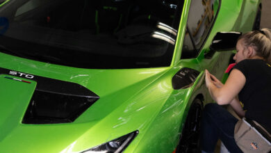 Person applying wrap to Lamborghini