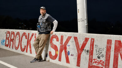 Brian Scotto leaning against concrete barrier