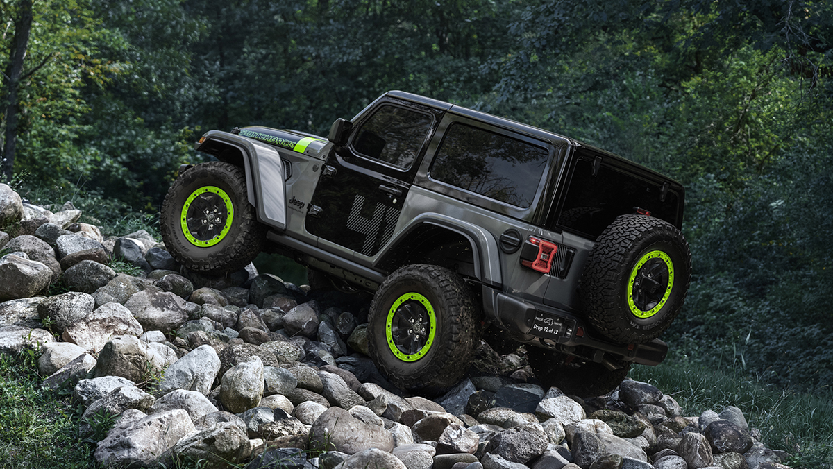 2027 Jeep Wrangler Switchback driving up rocky path