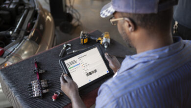 Auto mechanic using tablet