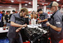 Students at AAPEX rebuilding V-8 engine