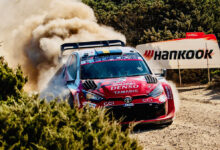 Rally car kicking up dust