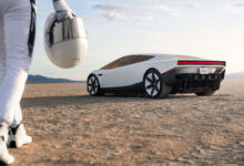 Tesla Roadster with man approaching