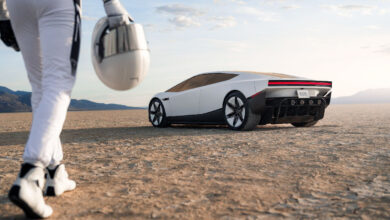 Tesla Roadster with man approaching