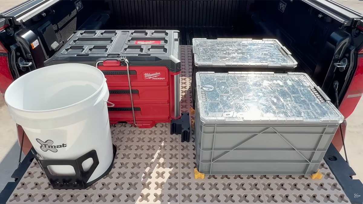 Tmat installed in bed of truck with boxes and bucket secured in place