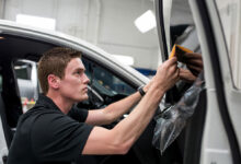 Person tinting car window